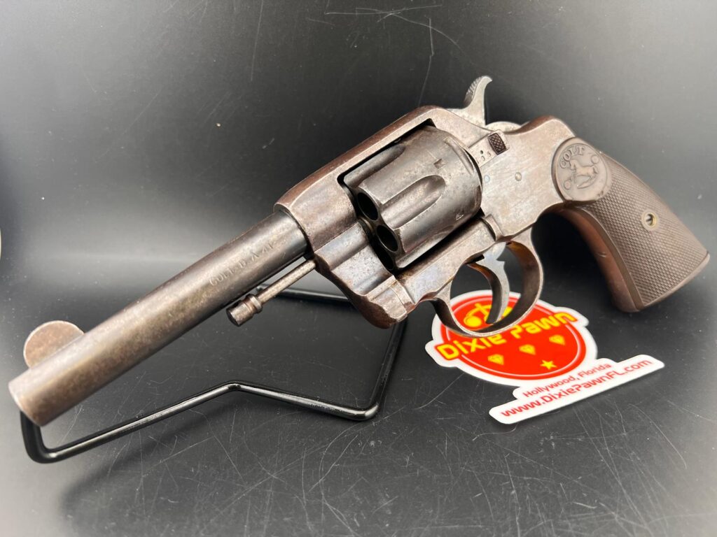 Colt D.A. 41 New Army and Navy Revolver & Dixie Pawn logo