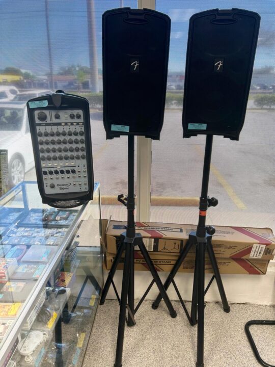 Fender Passport 500 Pro All-In-One PA System on display at Dixie Pawn, featuring a portable speaker setup with built-in mixing, multiple input options, and an easy-carry handle