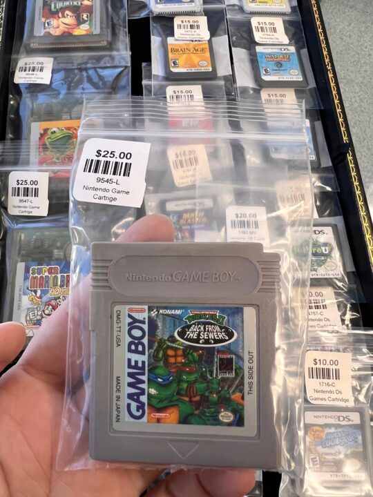 An original Nintendo Game Boy cartridge featuring the Teenage Mutant Ninja Turtles video game, a classic retro gaming treasure available at Dixie Pawn in Hollywood, Florida.