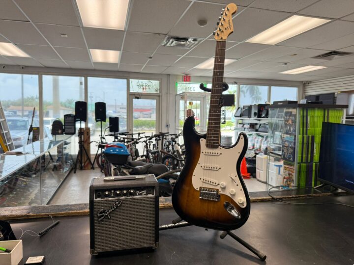 Pawn or sell your Squier Strat at Dixie Pawn, Hollywood FL - Dixie Pawn & Jewelry Squier Stratocaster electric guitar pawned at Dixie Pawn in Hollywood, Florida